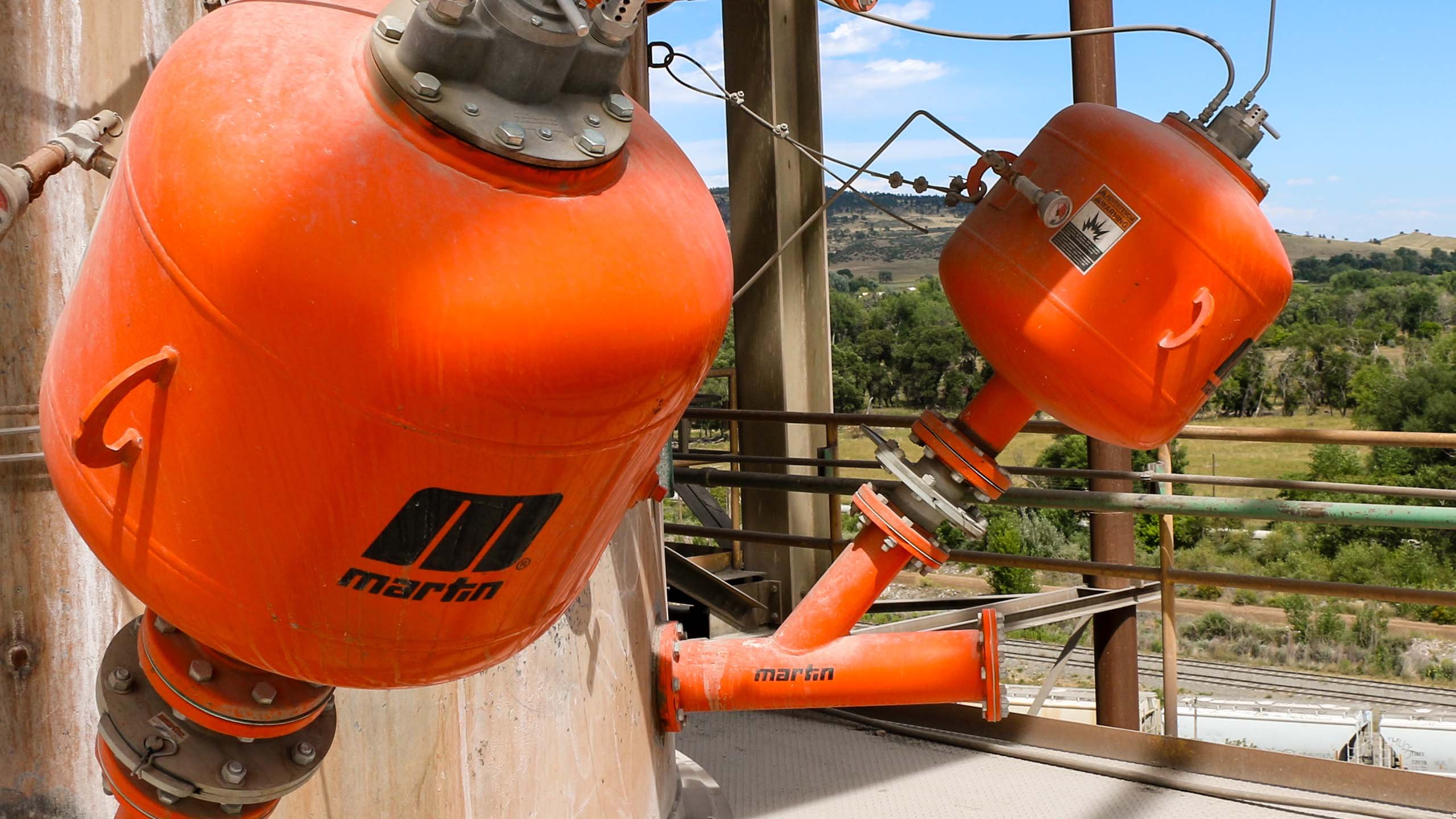 Air cannons prevent buildup in chutes & vessels Martin Engineering